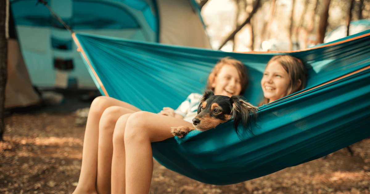Children on a hammock at the campsite