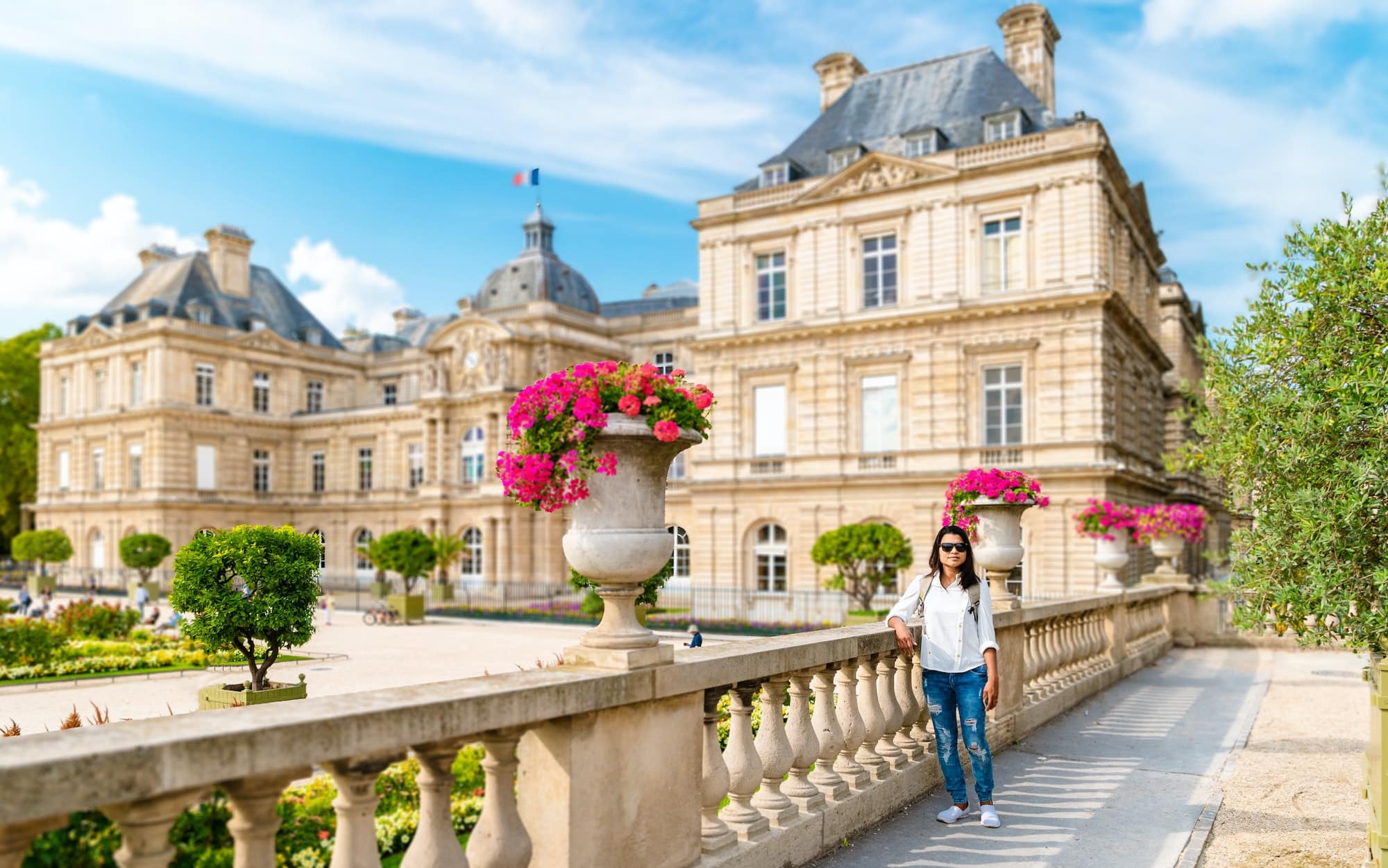 Asian women visiting Le Jardin Luxembourg park in Paris during summer in the city of Paris France