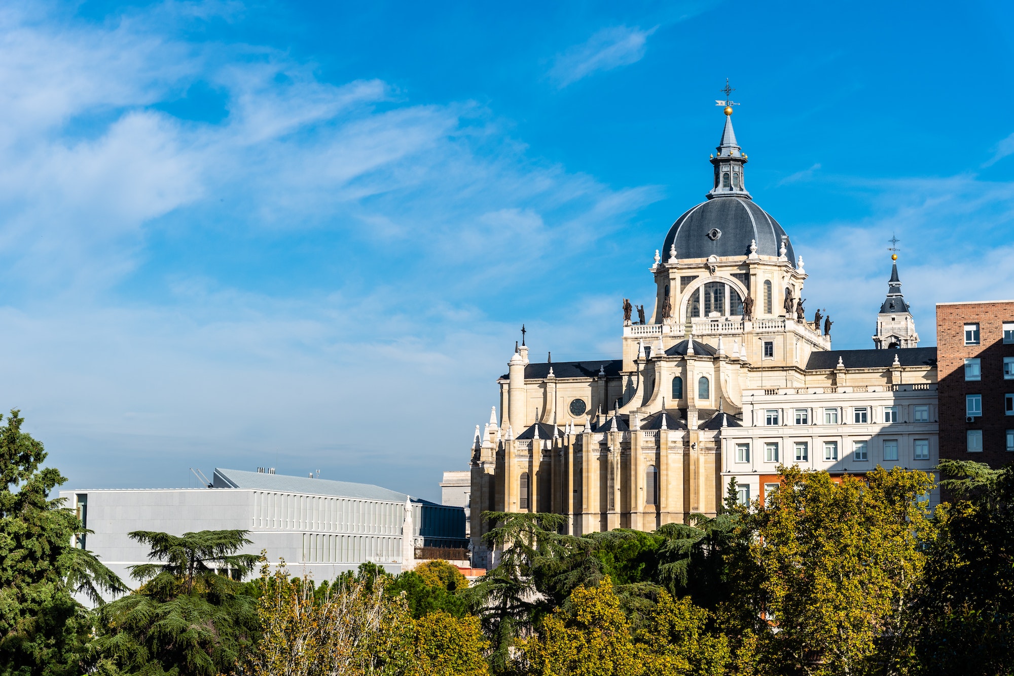 Cityscape of Madrid with Almudena Cathedral a blue sky day